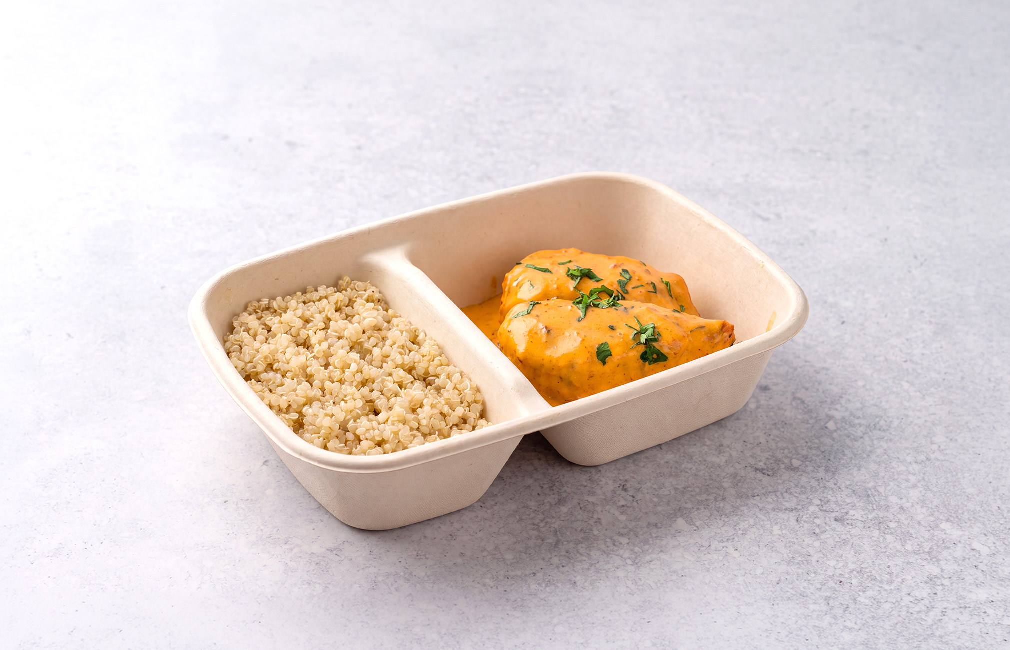 Salmon with creamy mustard sauce and spinach served with Quinoa